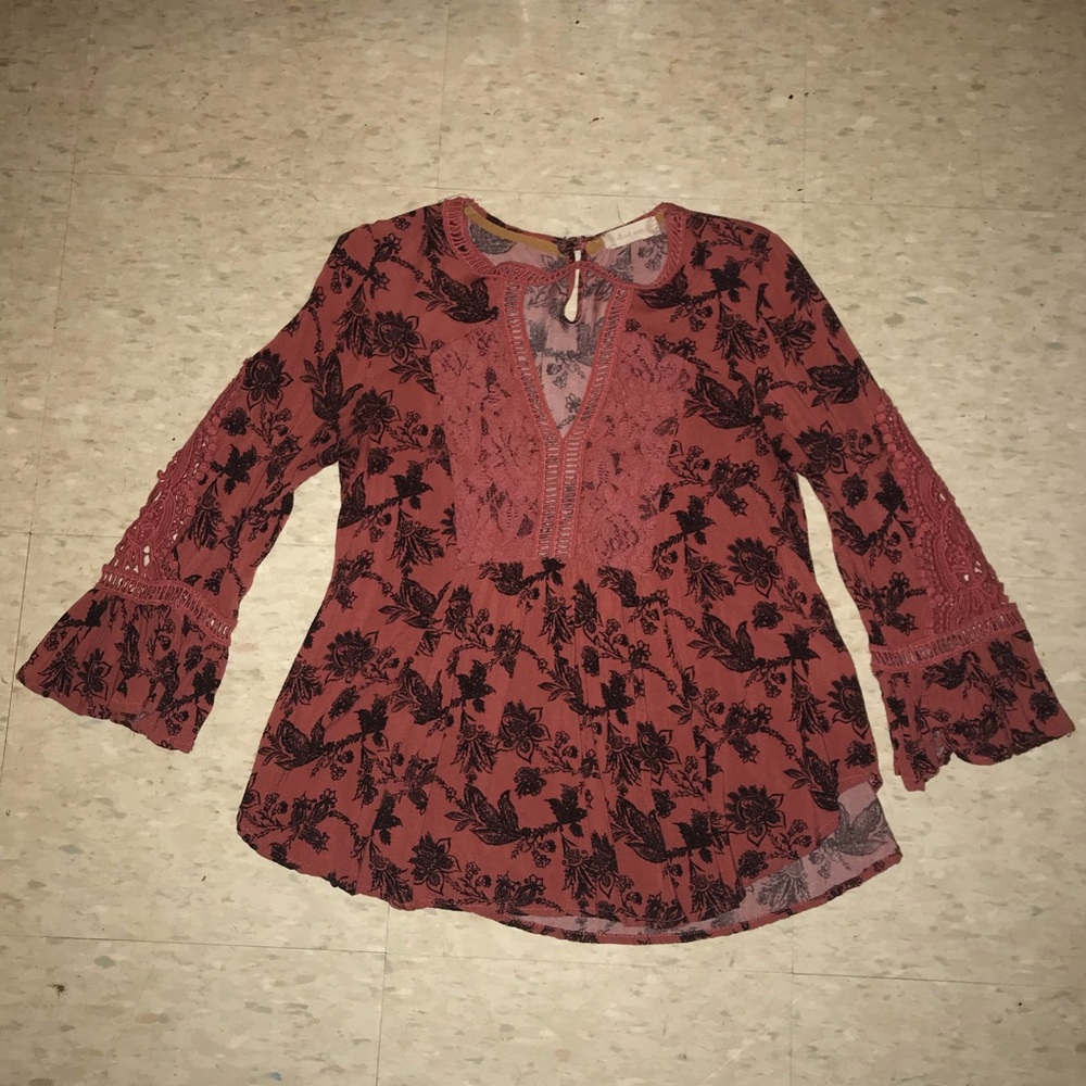 A gorgeous pink top with floral detailing